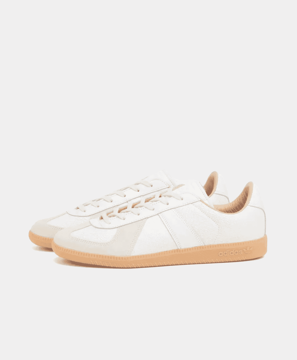A pair of white Adidas Originals BW Army Trainer sneakers with gum soles on a white background.
