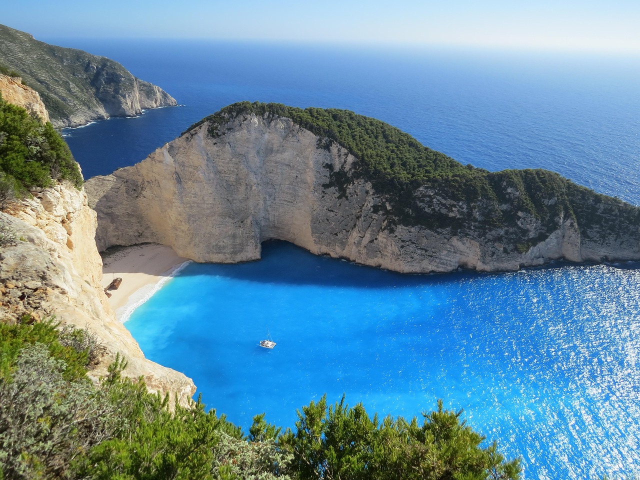 Rugged limestone cliffs and infinity pools define the Greek coastal soul.