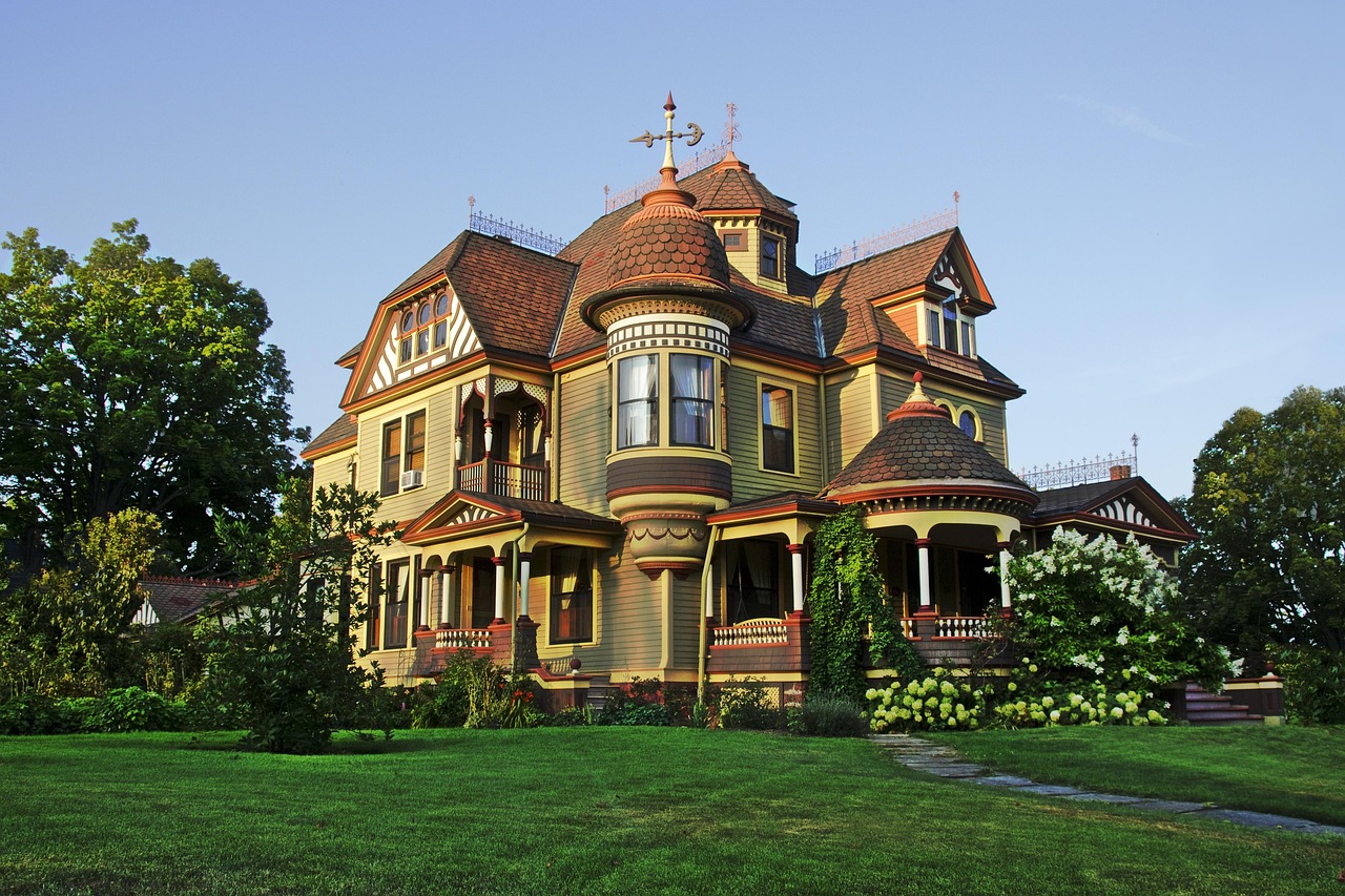 A beautiful Victorian style mansion with a large porch
