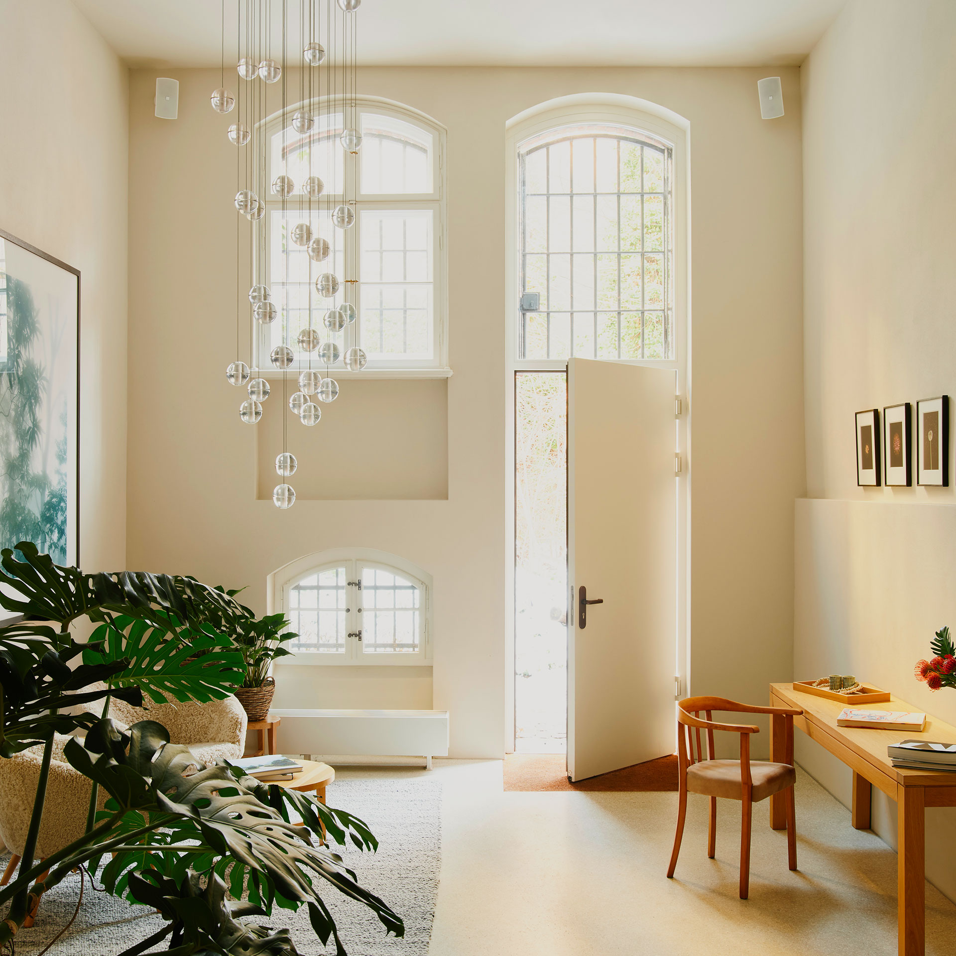 The bright and airy interior of a room at Wilmina Hotel featuring soft neutral tones and warm lighting.