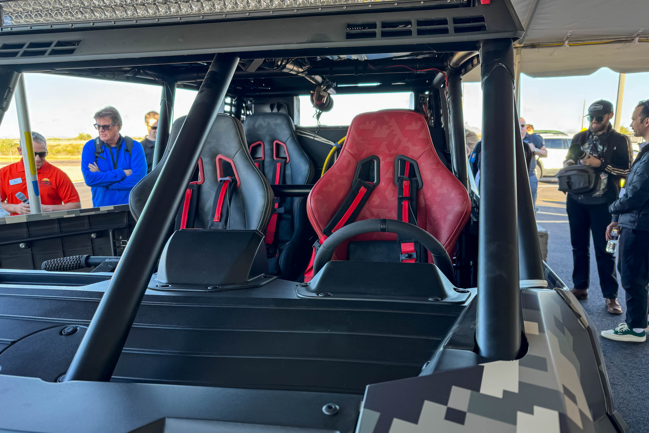 A side view of the Scion 01 chassis showcasing the long-travel suspension components and Maxxis tires.