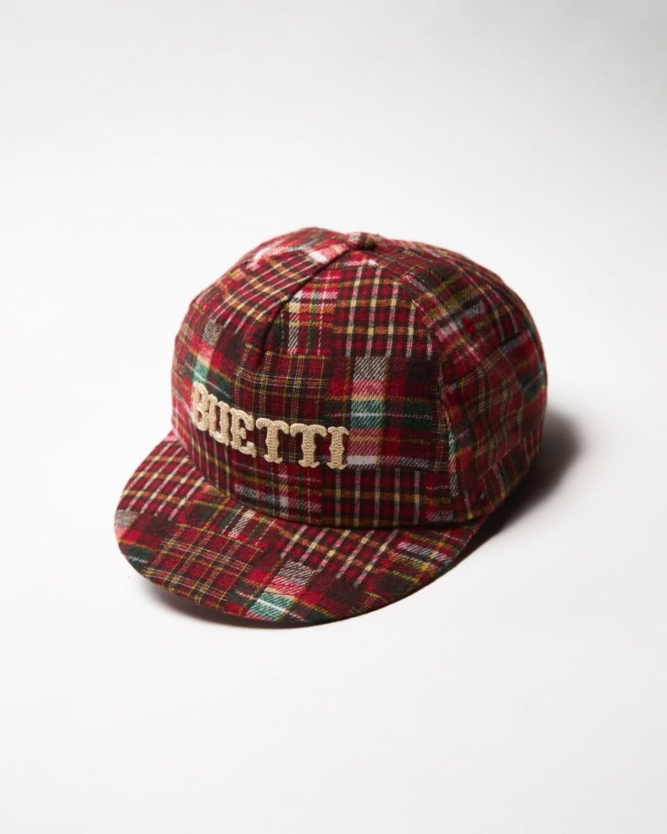 Plaid baseball cap with Buetti embroidery against a white background.