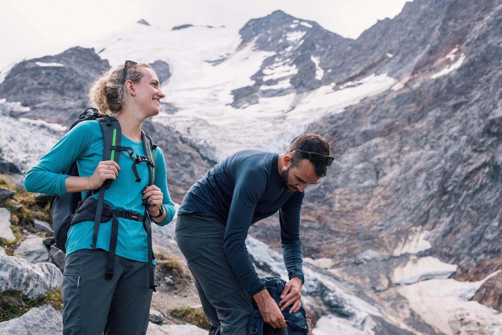 A hiker trekking in the Alps wearing a Kepler merino wool base layer.