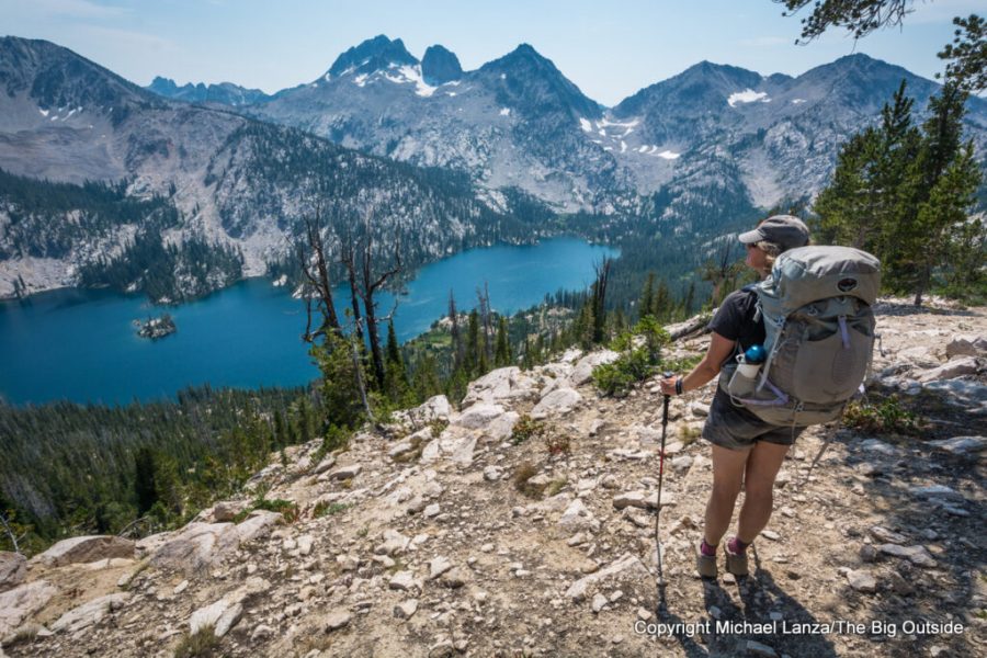 Backpacker standing above Toxaway Lake in the Sawtooth Mountains