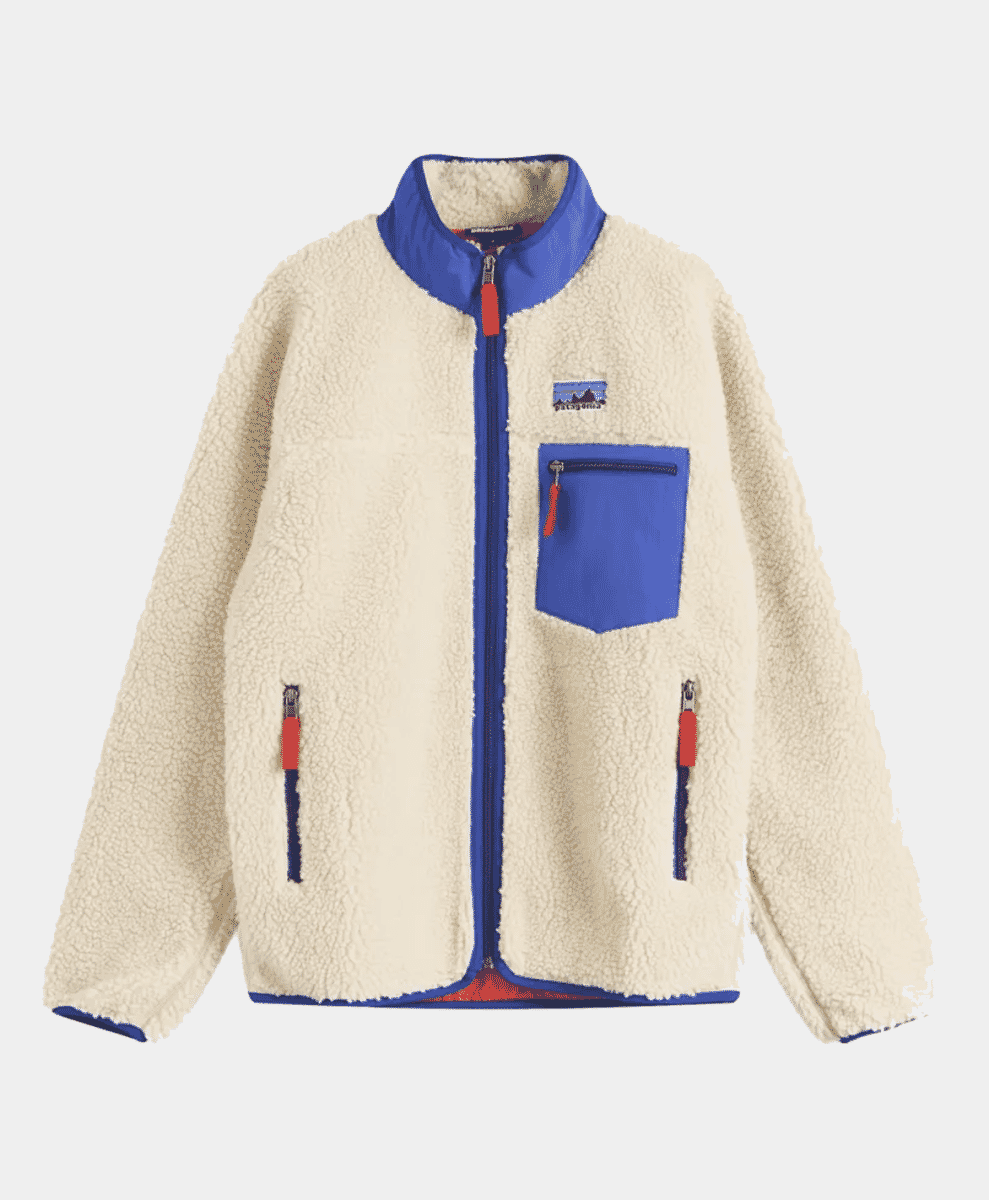 A cream-colored Patagonia fleece jacket with blue accents and red zipper pulls on a white background.