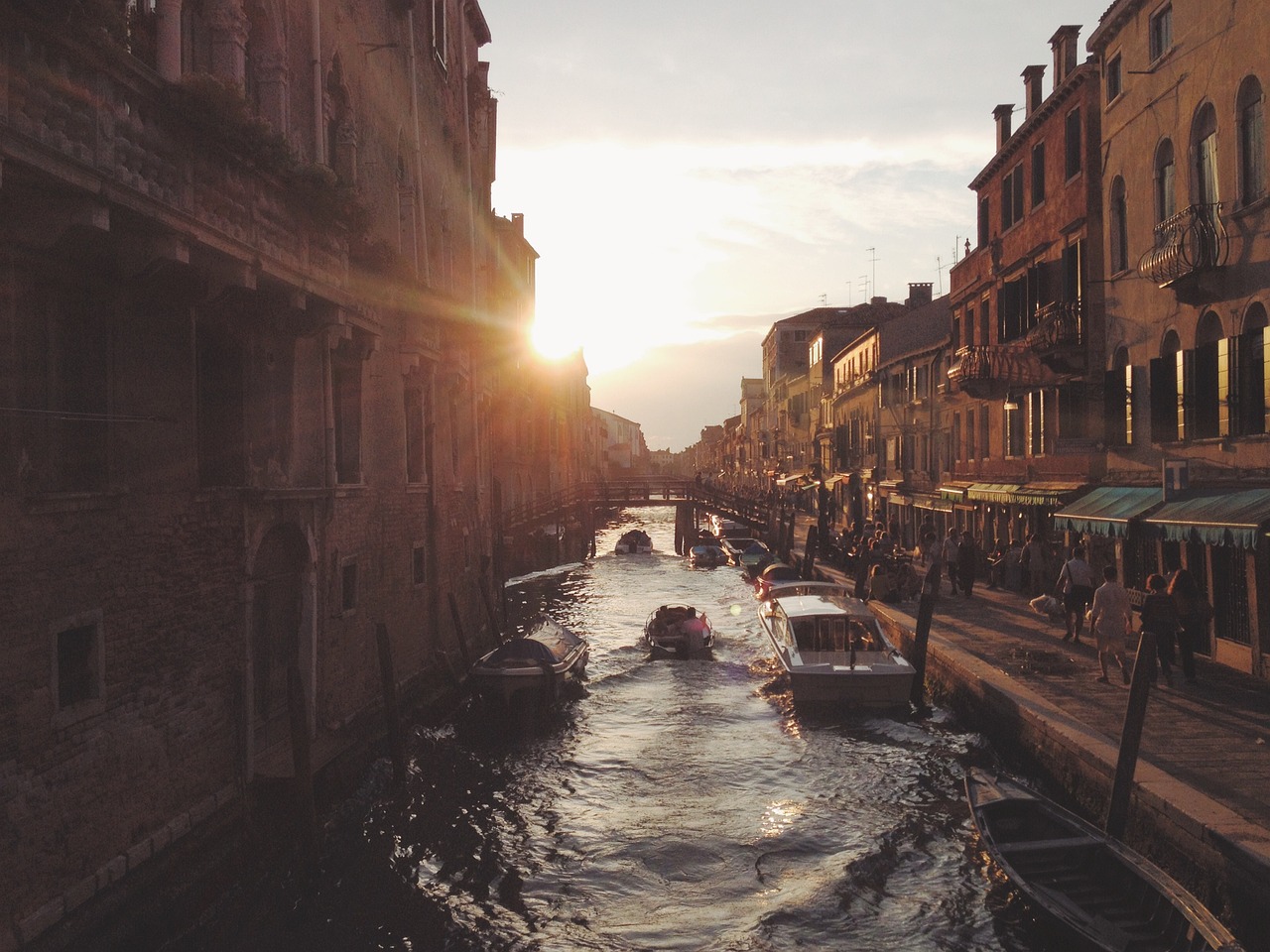 A quiet canal in Venice during the winter golden hour.