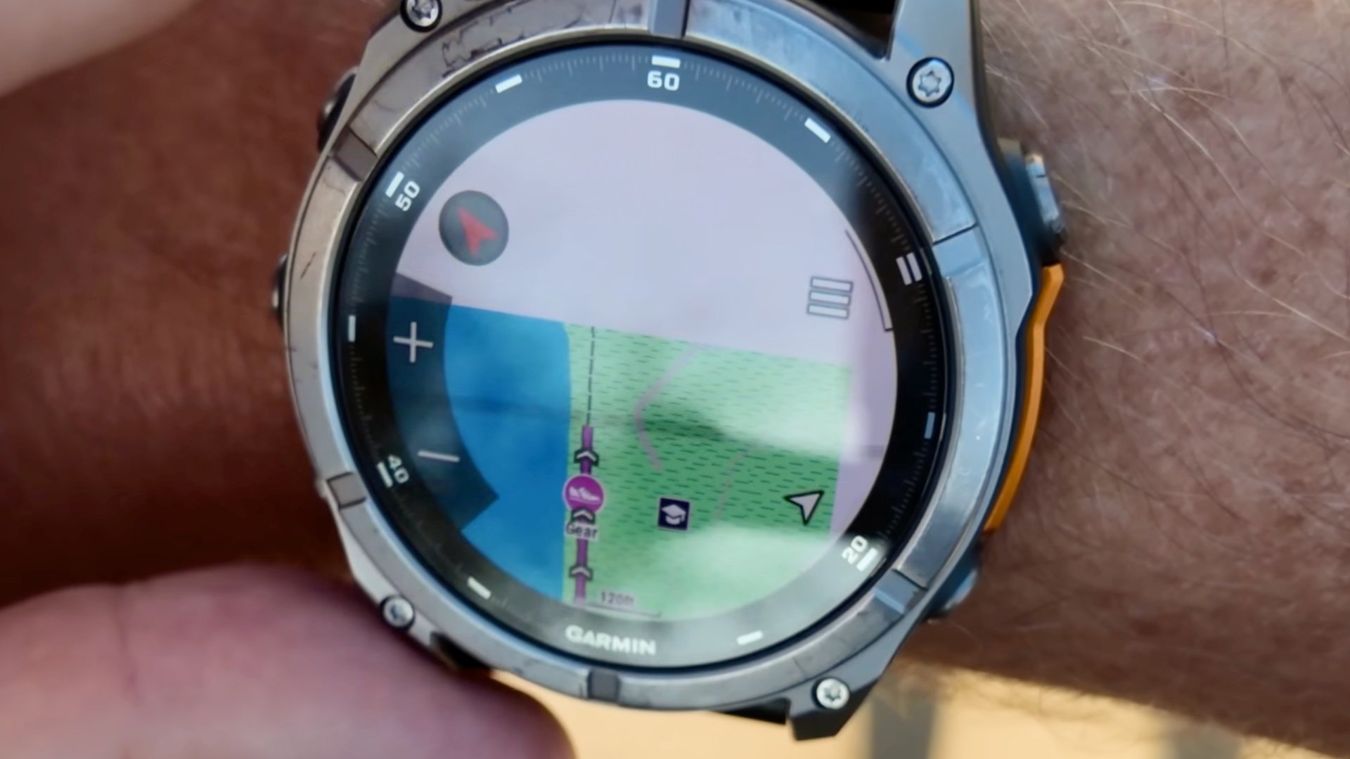 Topographical maps and navigation routing displayed on the Garmin fenix 8 watch face.