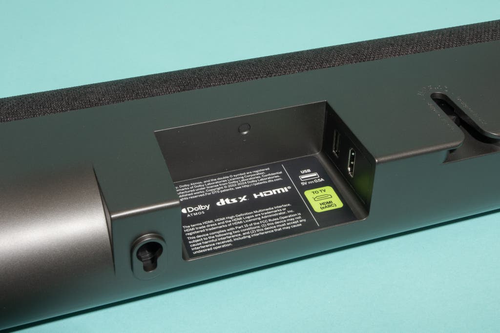 Close-up of the input and output ports on the rear of a soundbar including HDMI and Optical connections.
