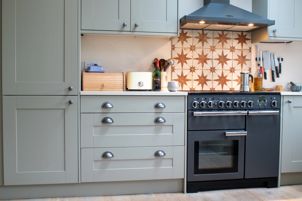 A portable warming oven being used in a vehicle interior during travel.