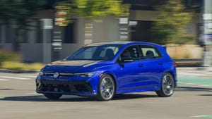 A blue Volkswagen Golf R, a key competitor in the high-performance hatchback market.