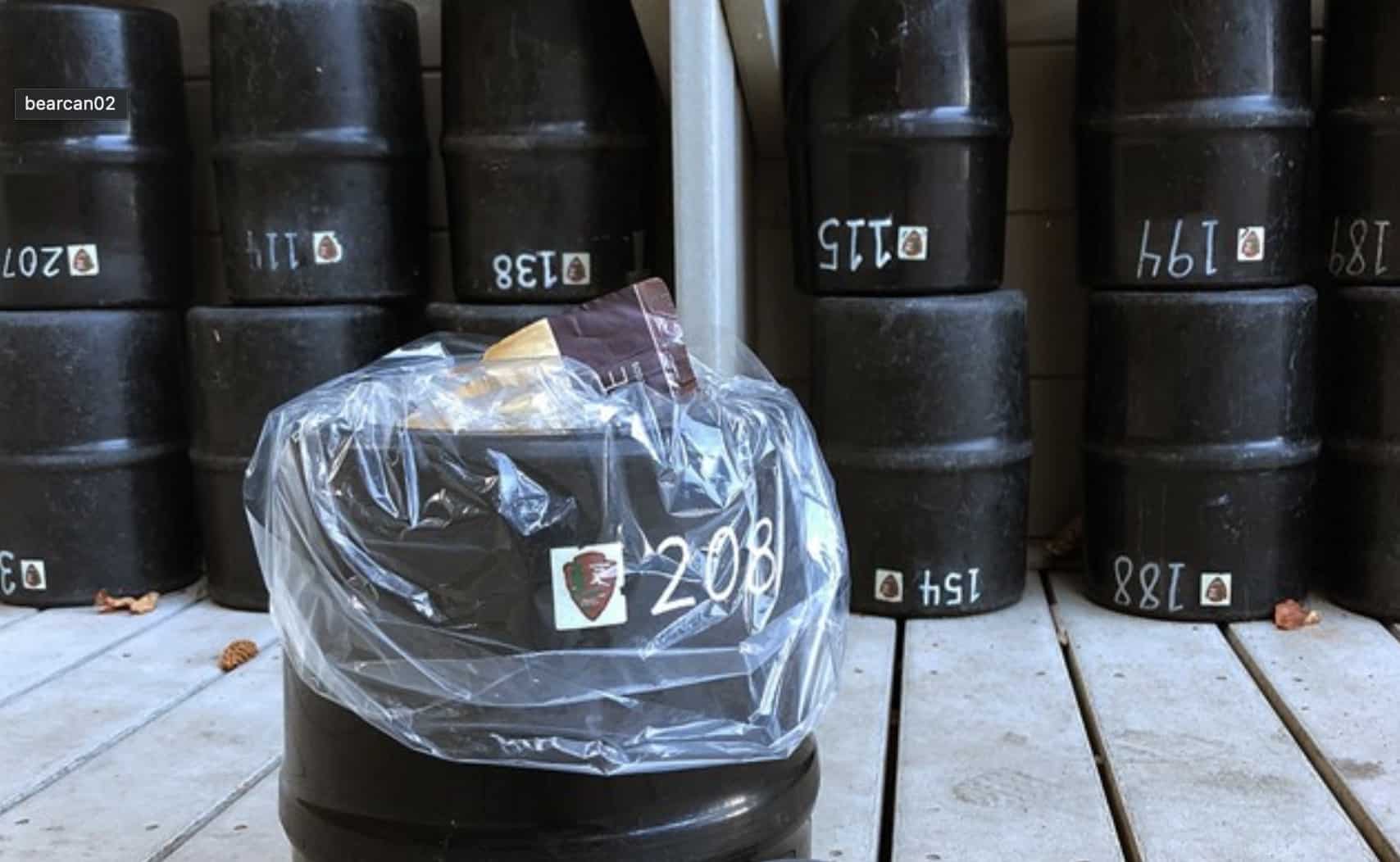 Multiple types of hard-sided, bear-resistant food storage canisters.