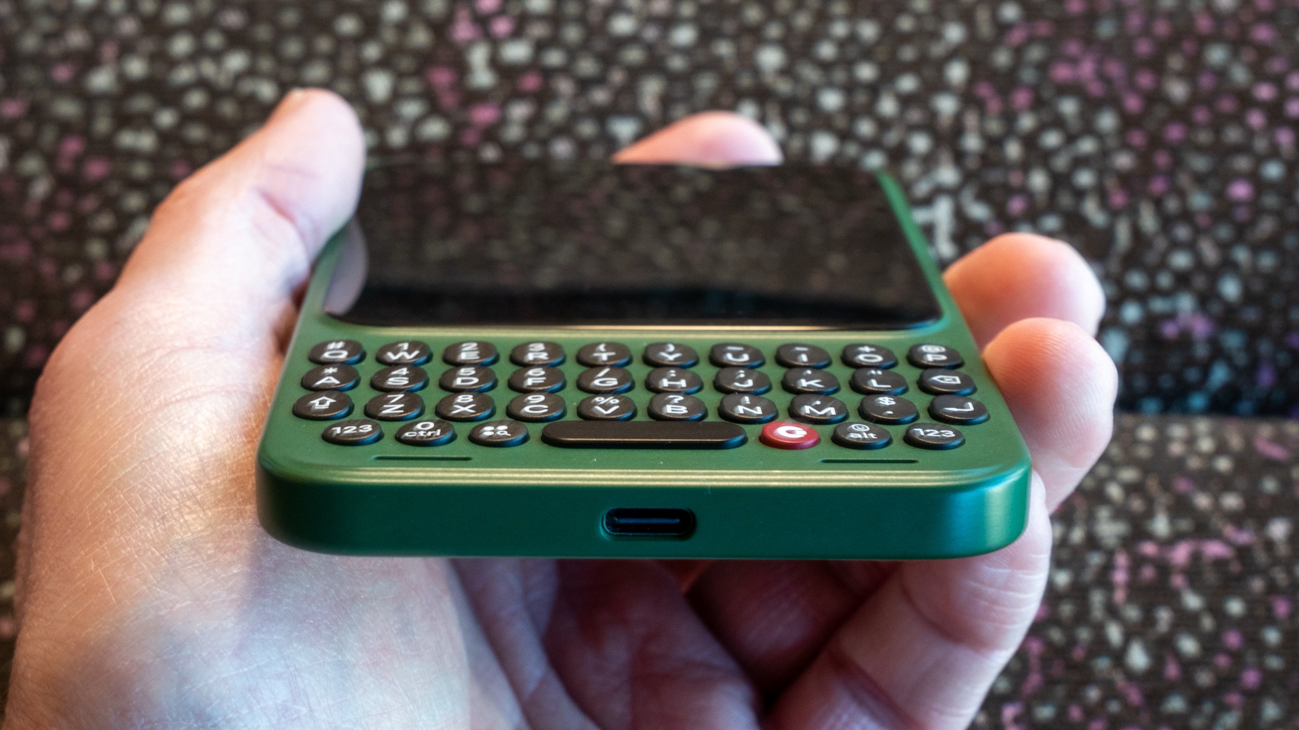 Macro shot of the sculpted QWERTY keyboard keys on the Clicks Communicator.