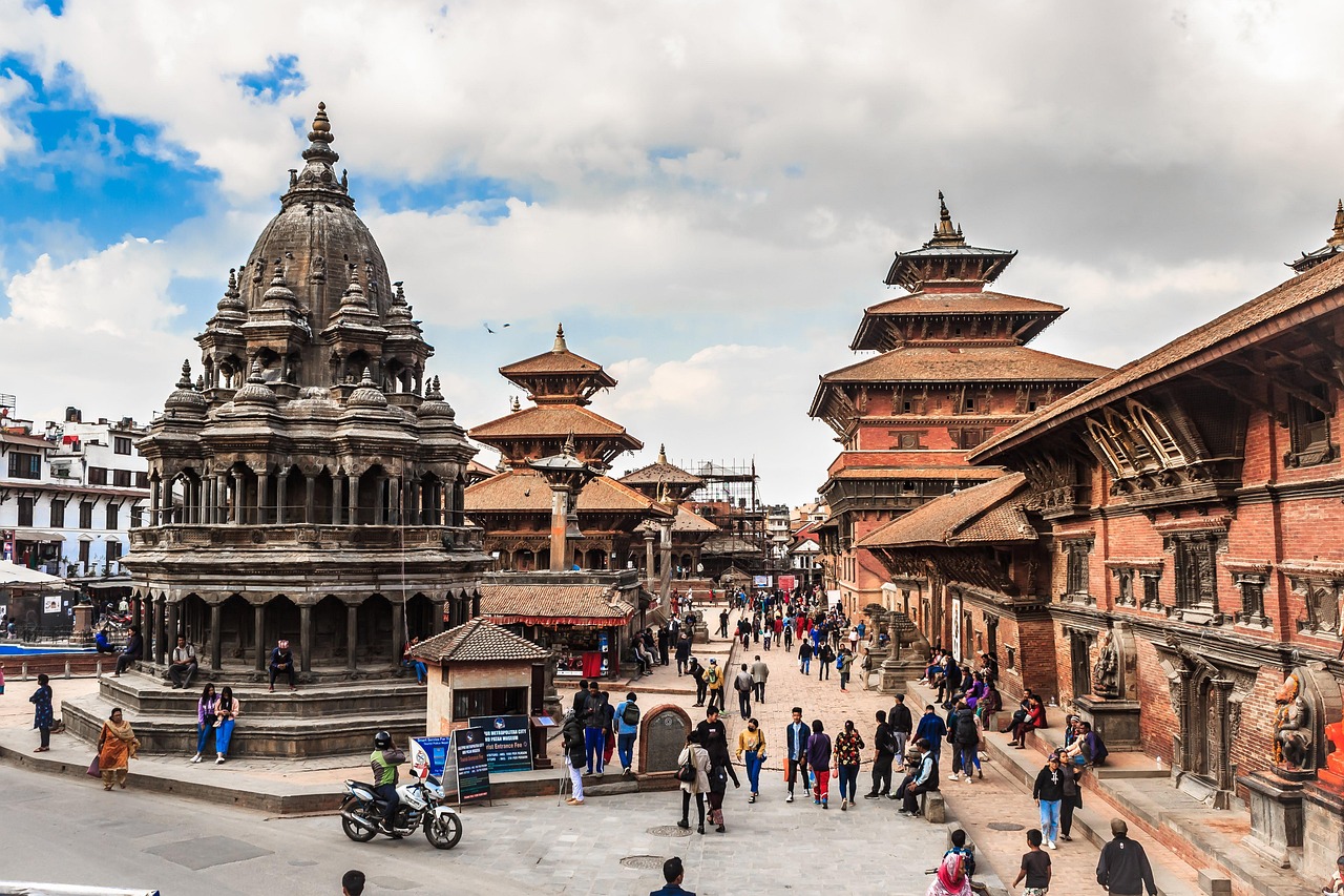 The intricate brick and wood carvings of a traditional temple in Patan Durbar Square.
