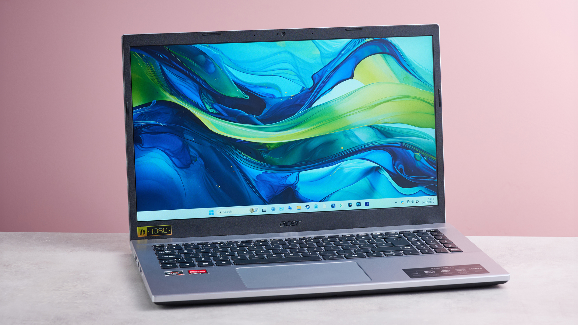 Acer Aspire Go 15 laptop sitting open on a desk.