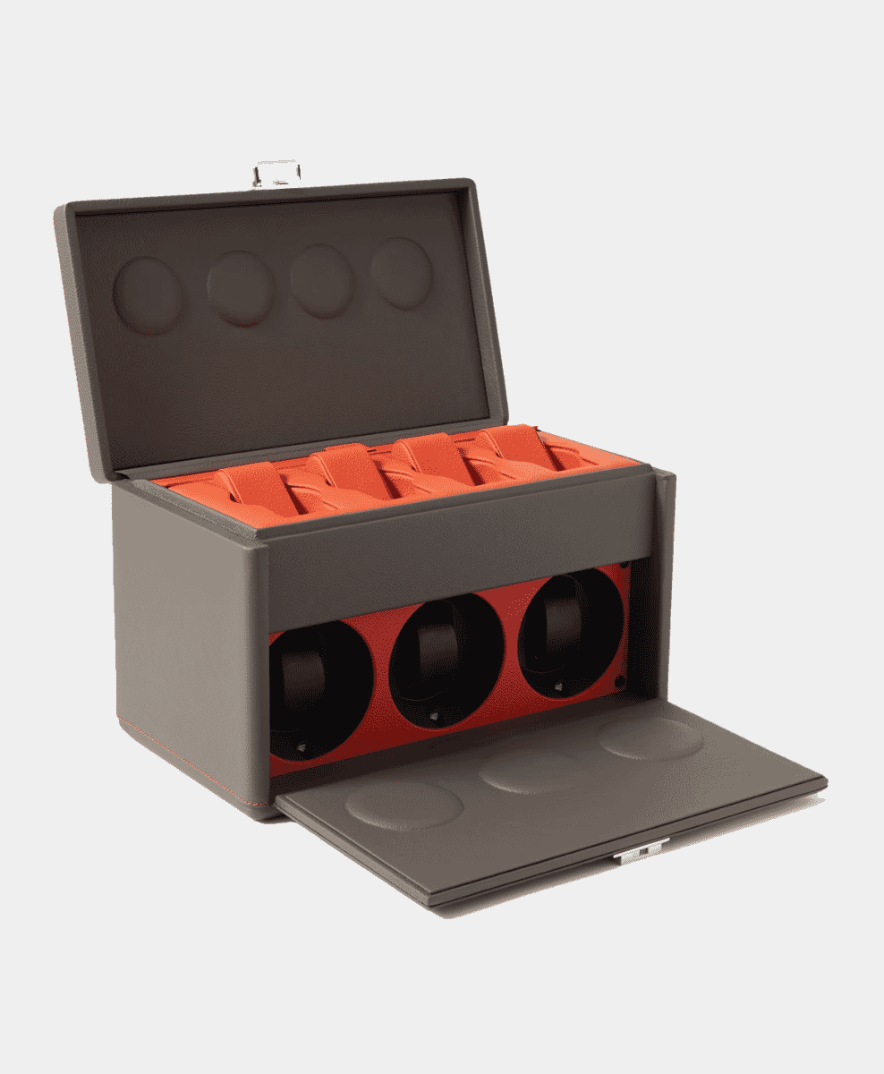 Gray leather watch box with three automatic rotating winders and orange interior.