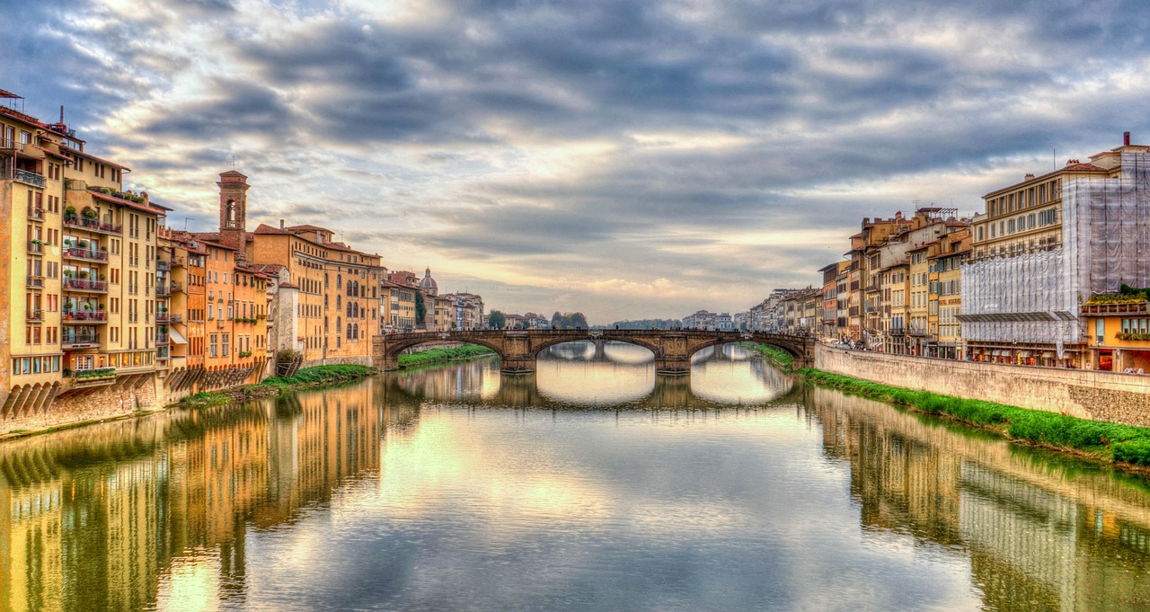 A charming narrow street in the Oltrarno district with local shops and cafes.