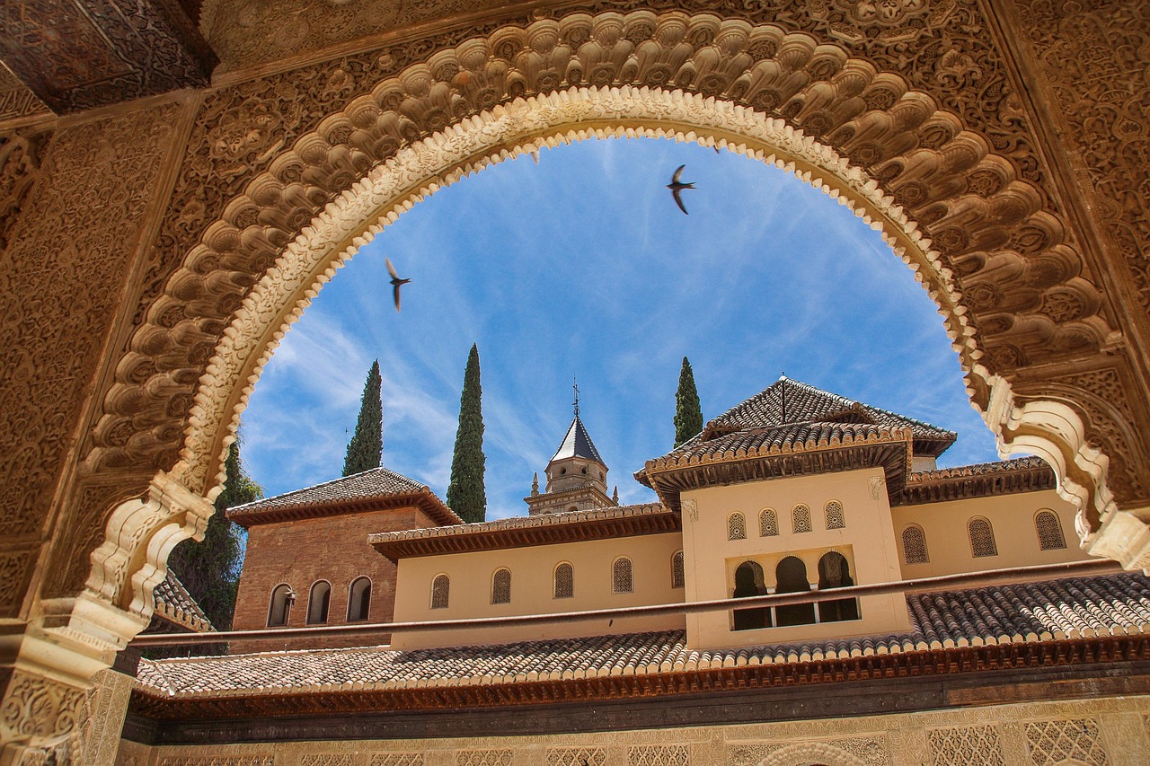 The ornate Moorish arches and lush gardens of the Alhambra.