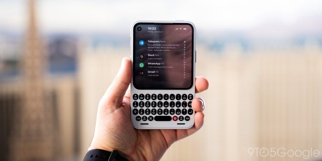 A detailed close-up of the Clicks Communicator's keyboard and its side profile wedge design.