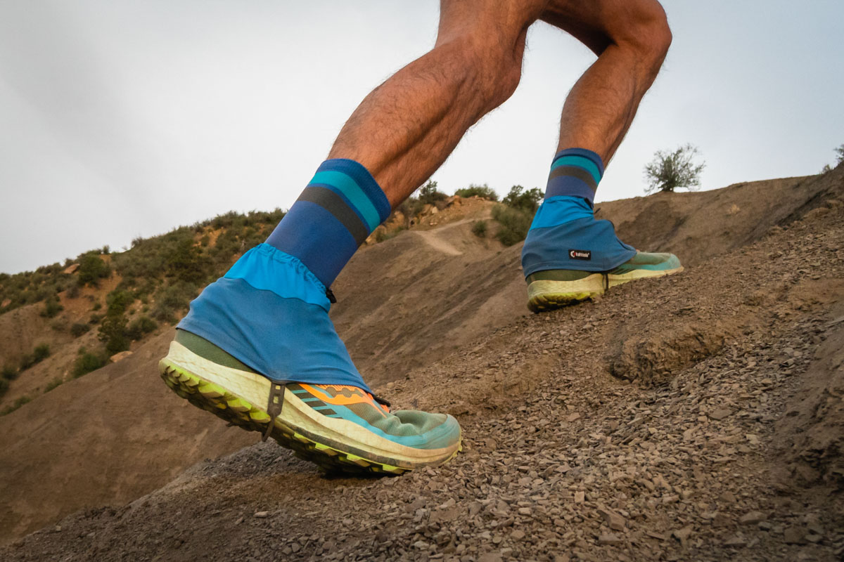 A montage or sequence of gaiters being tested on various trail surfaces.