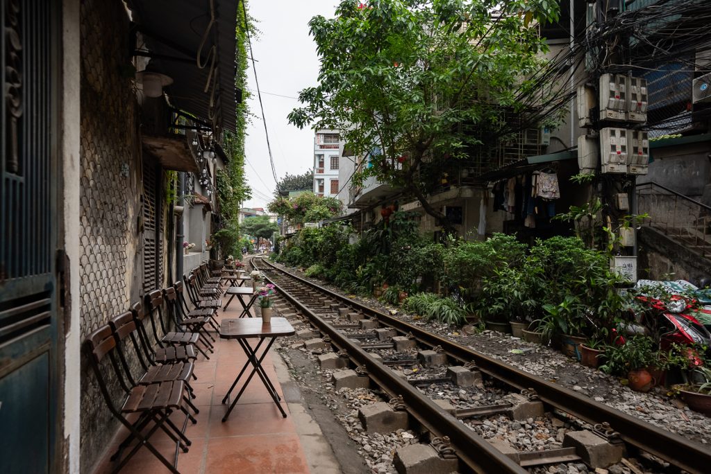 A perspective view of the railway tracks in the Le Duan section of Hanoi, showing a more relaxed residential atmosphere.