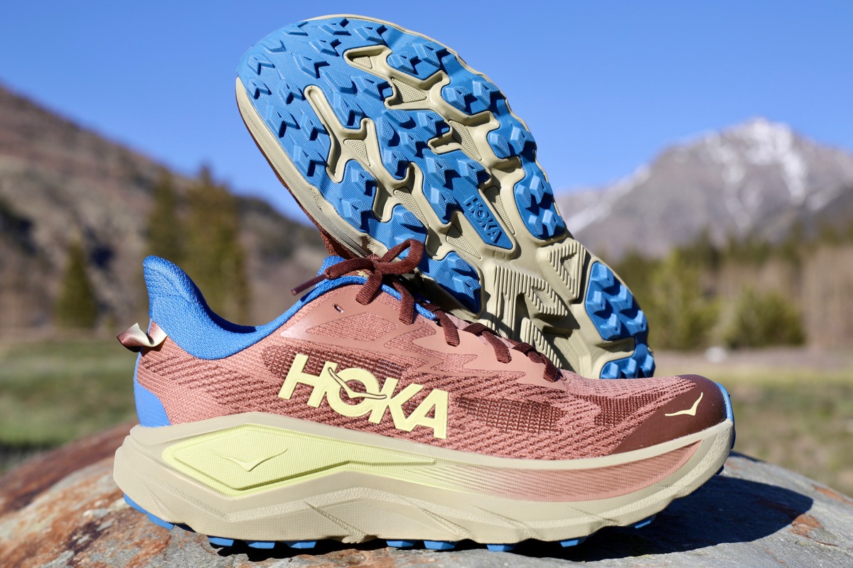The Hoka Challenger 8 trail shoe on a dusty dirt path.