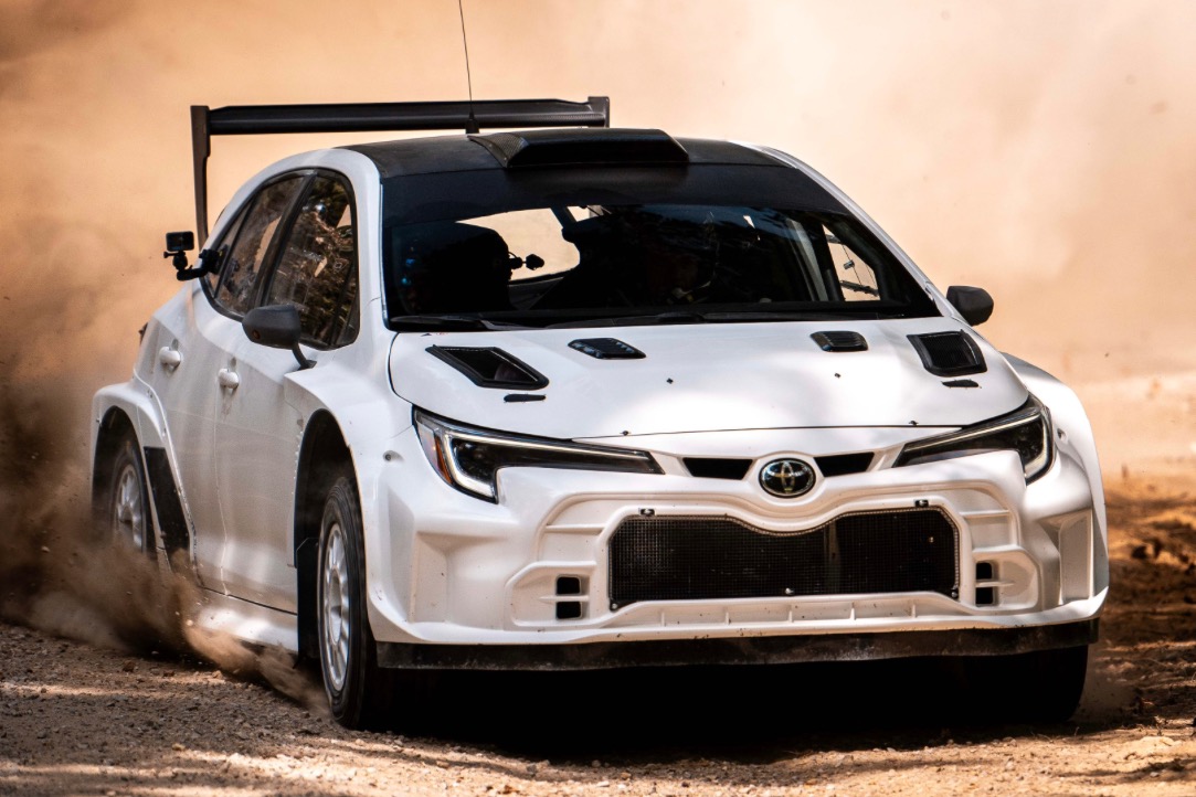 Side profile of the Toyota GR Corolla RC2 rally car with GAZOO Racing livery.