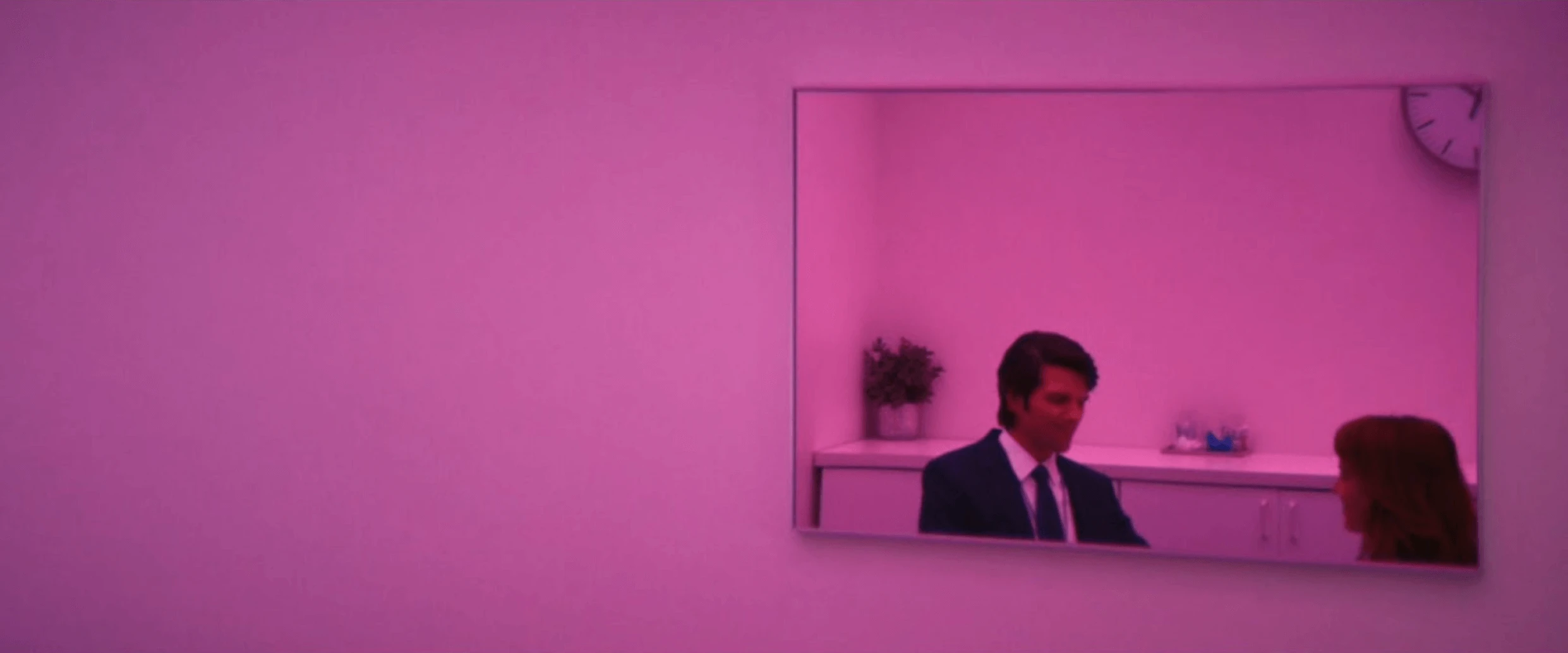 Characters dancing under colorful strobe lights in the MDR office.