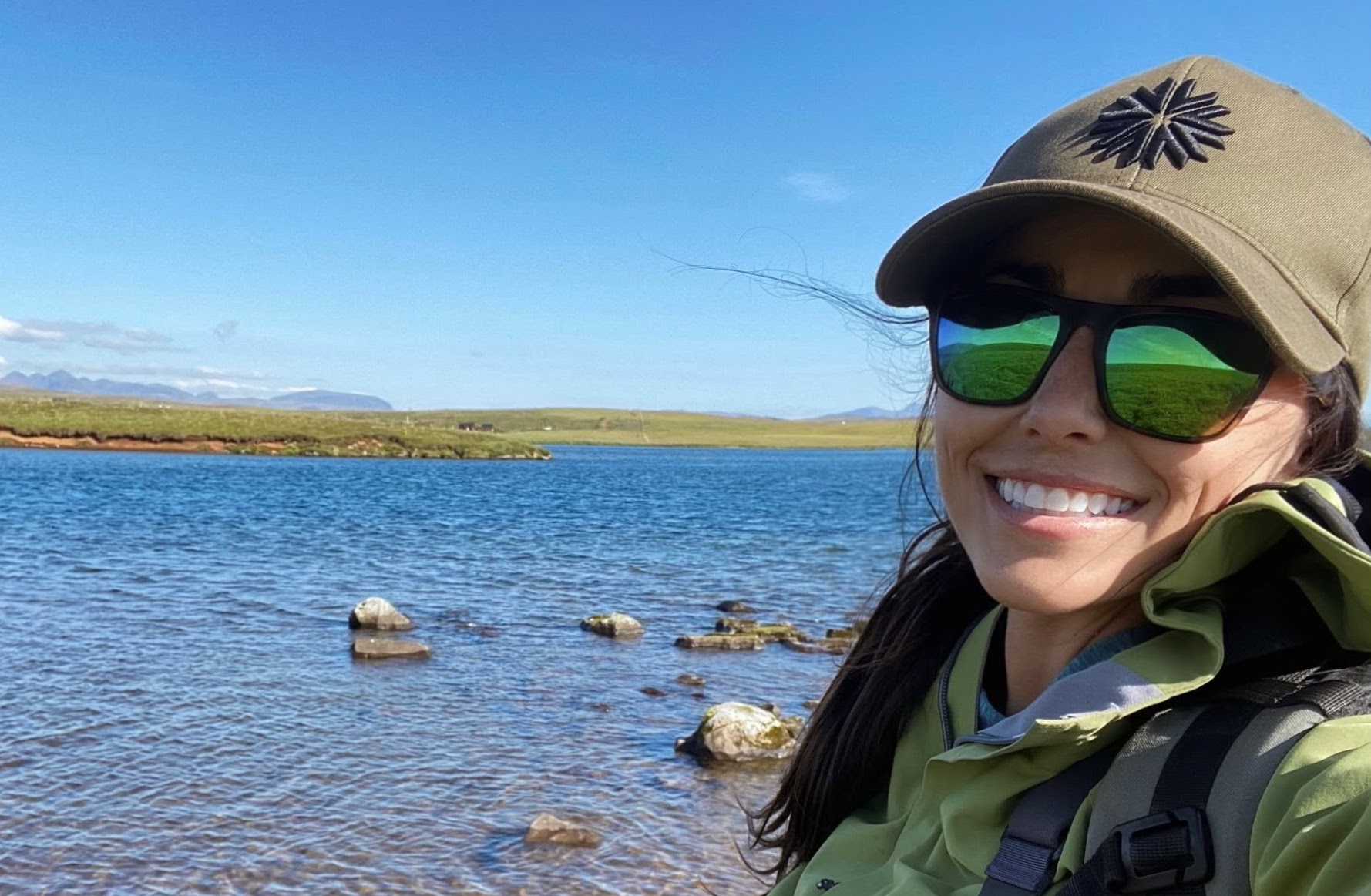 A display of several fishing sunglasses featuring different lens tints including blue, green, and copper.