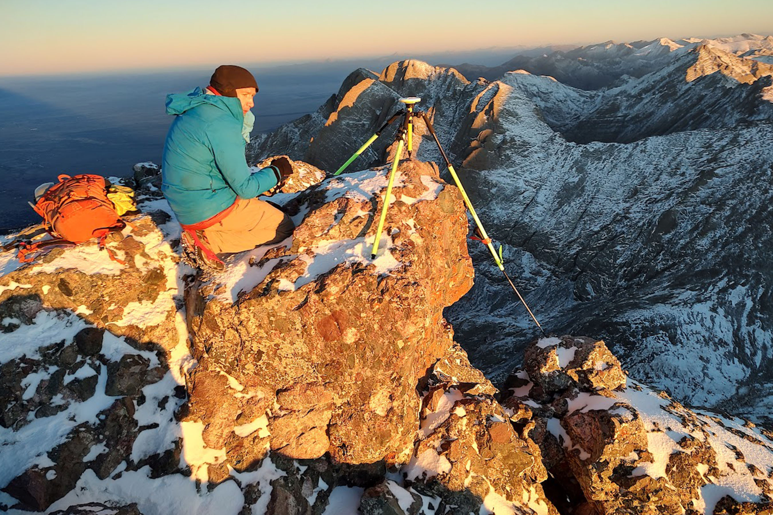 A close-up of a Trimble DA2 dGNSS receiver mounted on a tripod for precision elevation surveying.