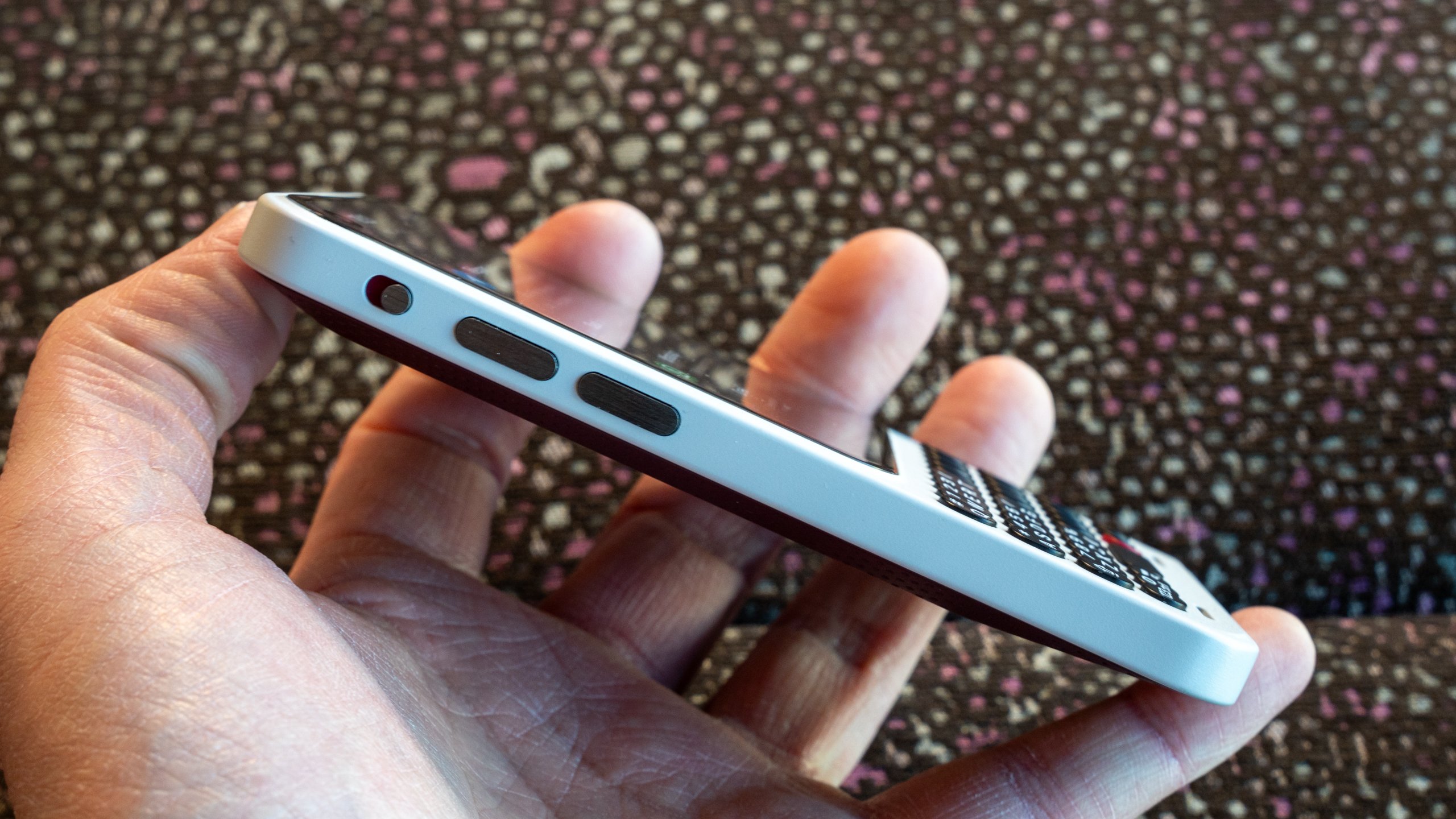 Close-up of the Clicks Communicator screen showing a minimalist Android launcher interface.