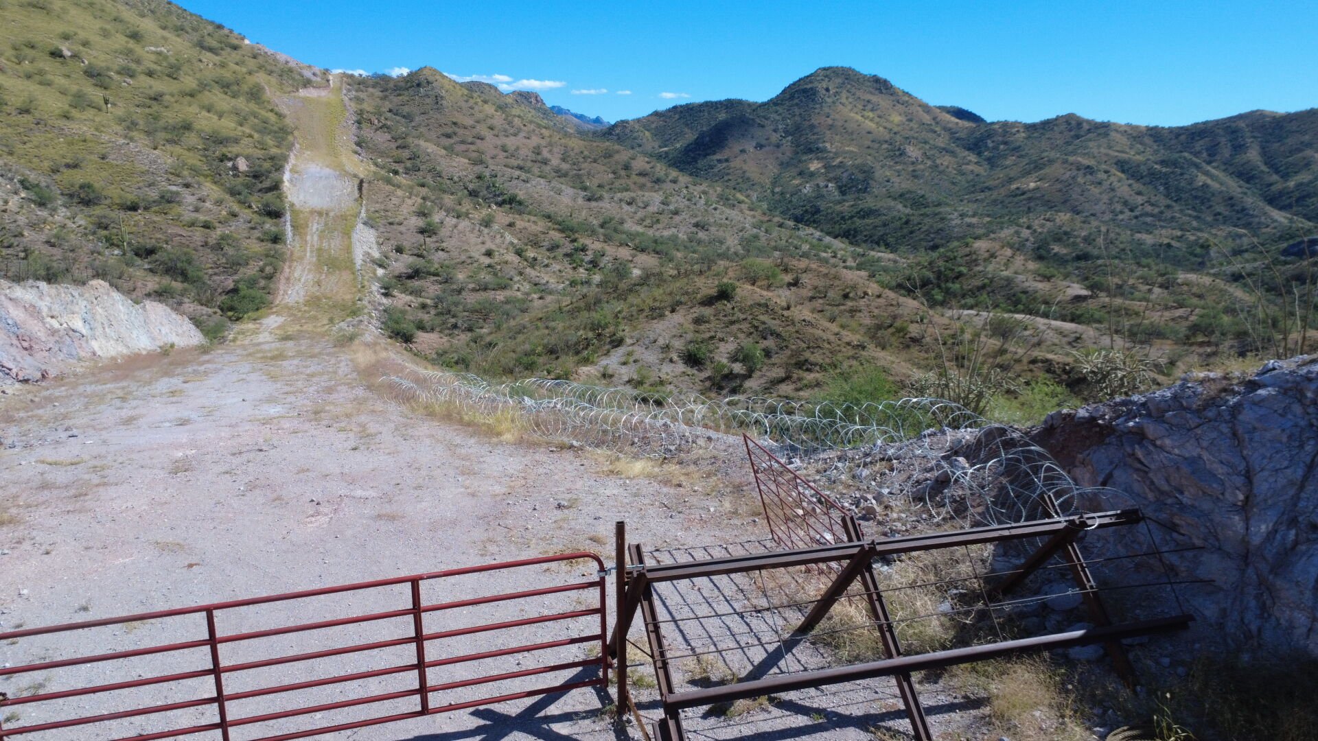 Coils of razor-wire spread across the desert floor near the Arizona border.