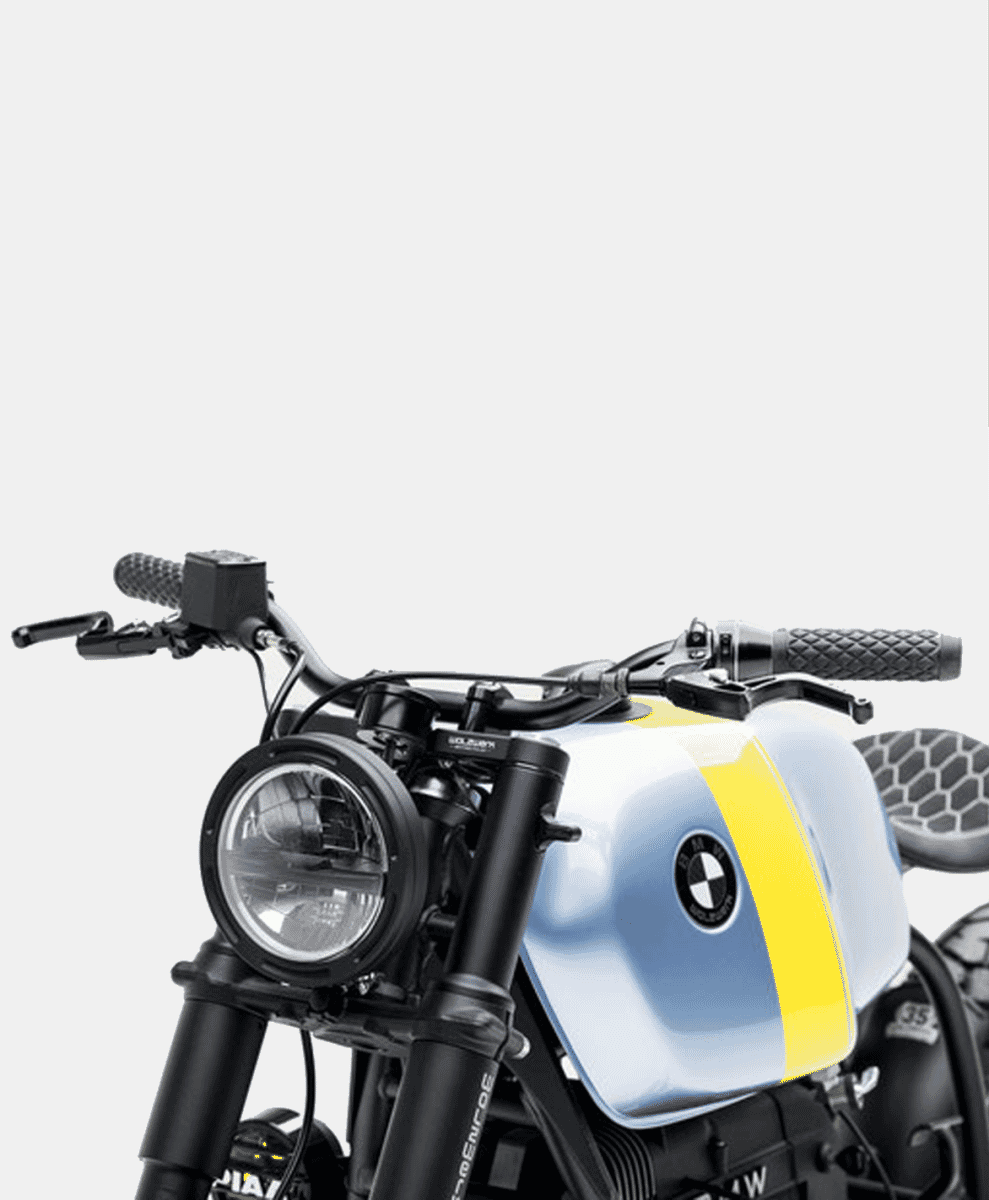 Front view of the custom BMW motorcycle showing the retro round headlight and black handlebars.