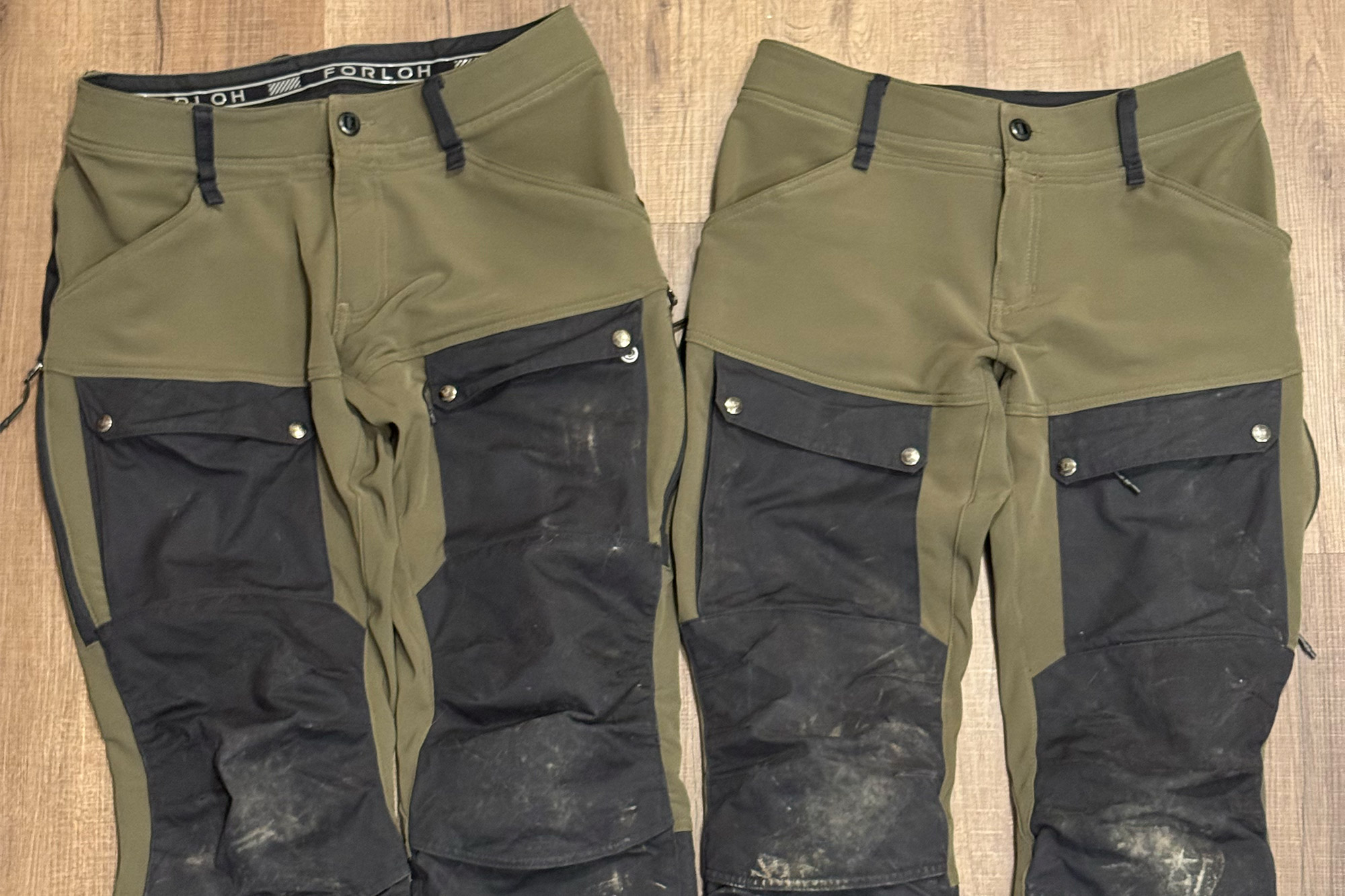 Flat lay of FORLOH BTM Pro pants showing the reinforced knee sections and pocket layout.