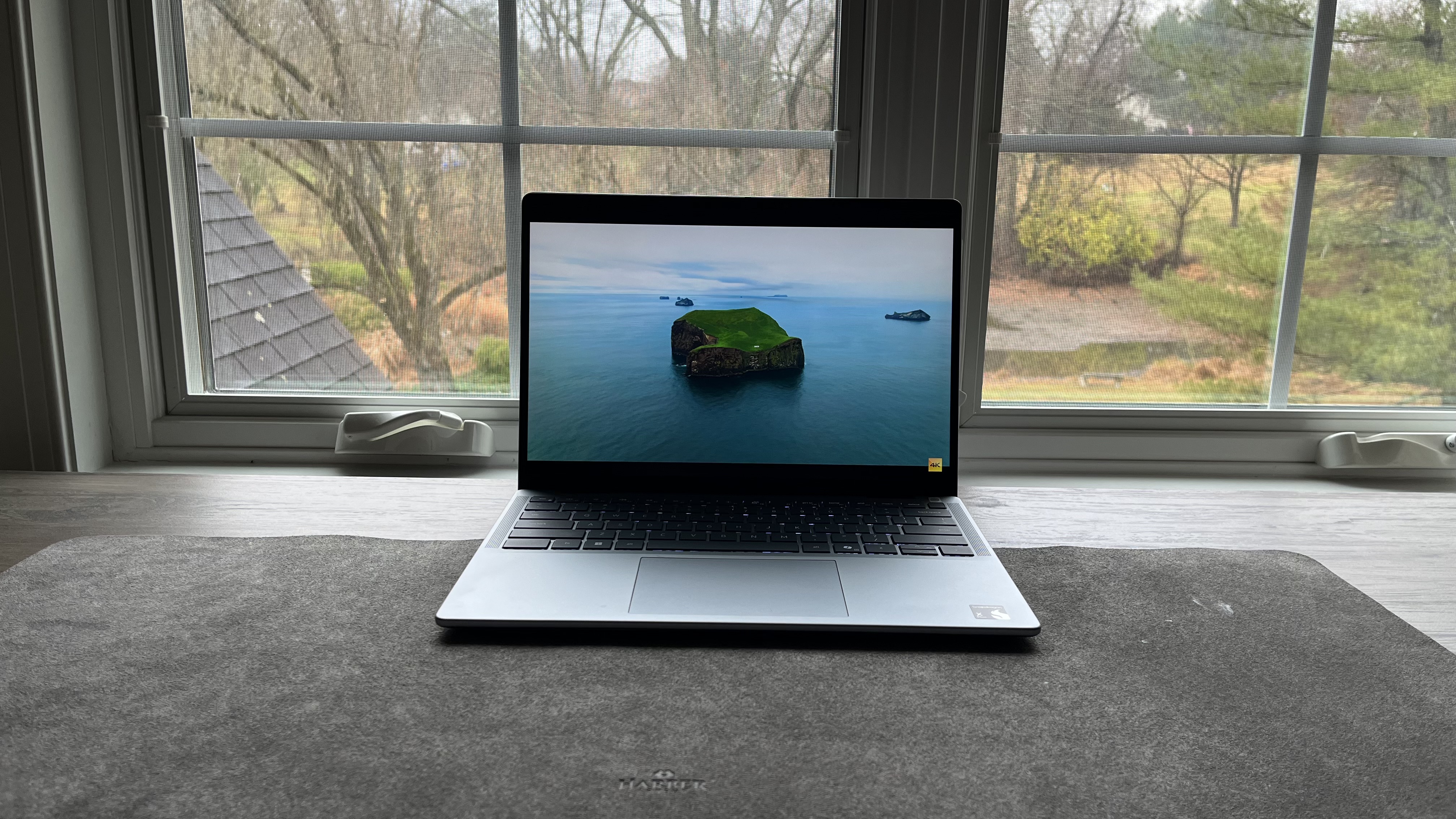 Front view of a Dell Inspiron 14 Plus laptop showing the screen and keyboard.