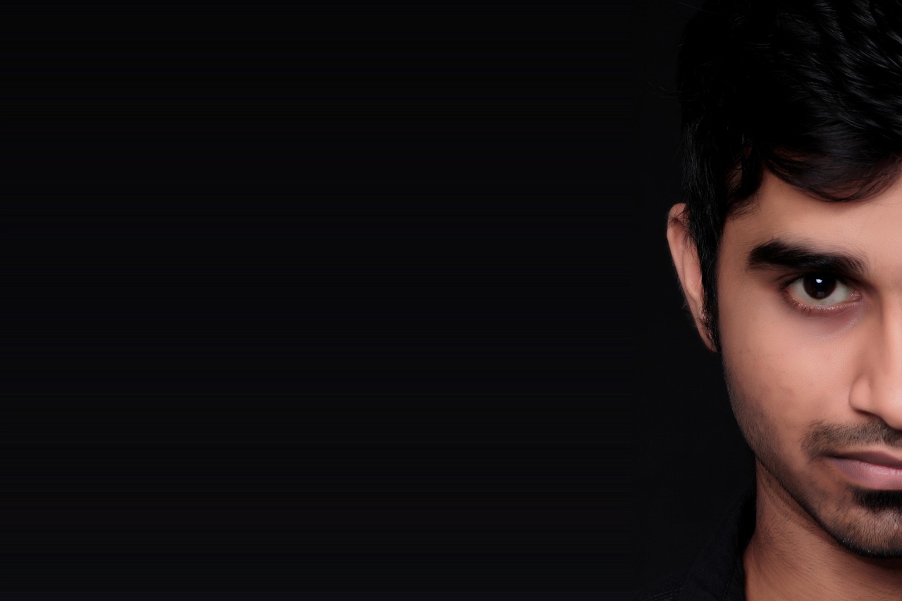 Clean, white minimalist furniture inside a room with historic architectural details.