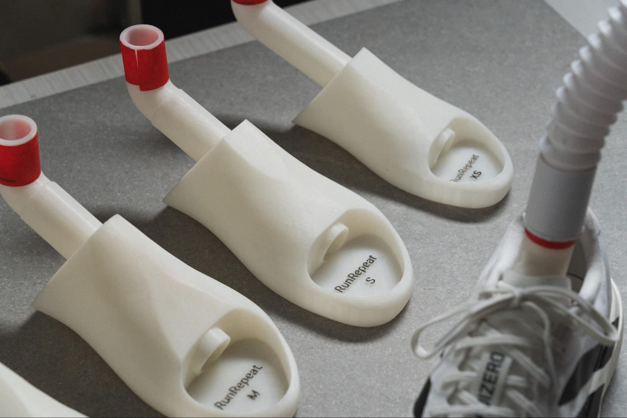 3D-printed foot molds used in a smoke machine test for shoe breathability.