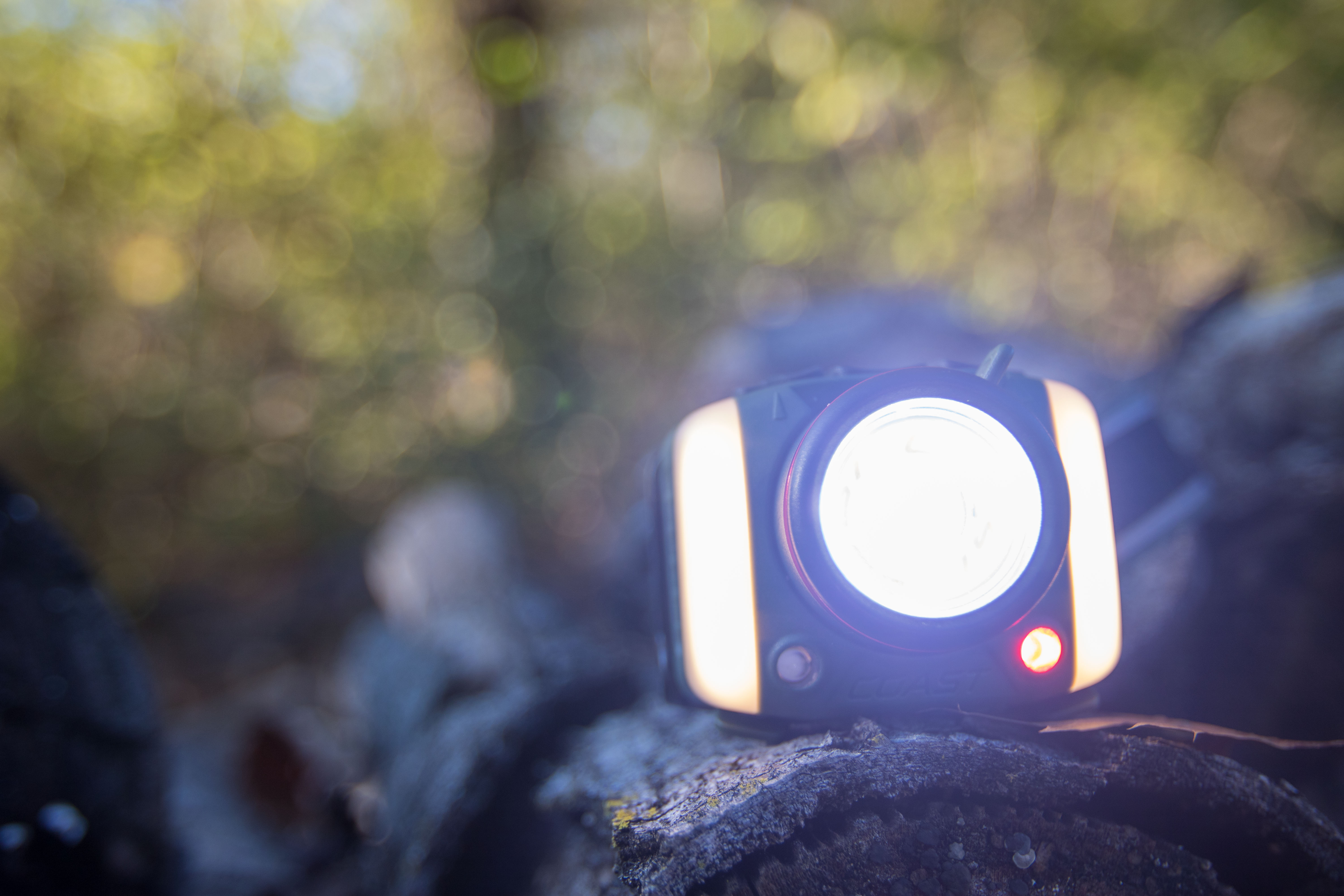 A frontal view of the headlamp showing several different LED colors lit up simultaneously.