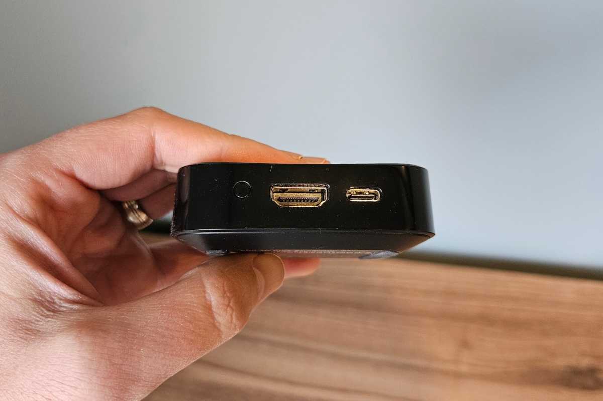 Rear view of the Onn 4K Plus streaming box showing the HDMI port and USB-C power connection.