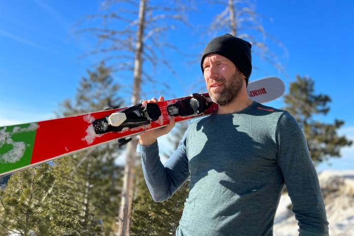A full set of thick wool base layers being tested in a snowy mountain environment.