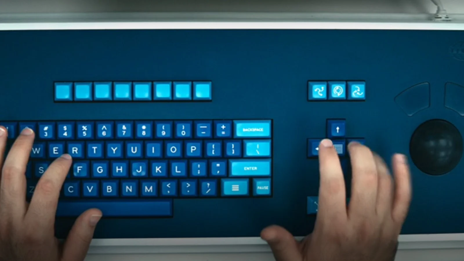 Close-up of a Lumon branded keyboard without an escape key.