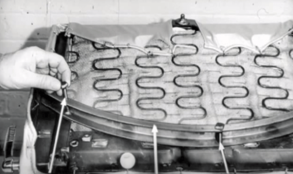 A technical diagram of a Chrysler swivel seat showing nylon rollers and a circular track.