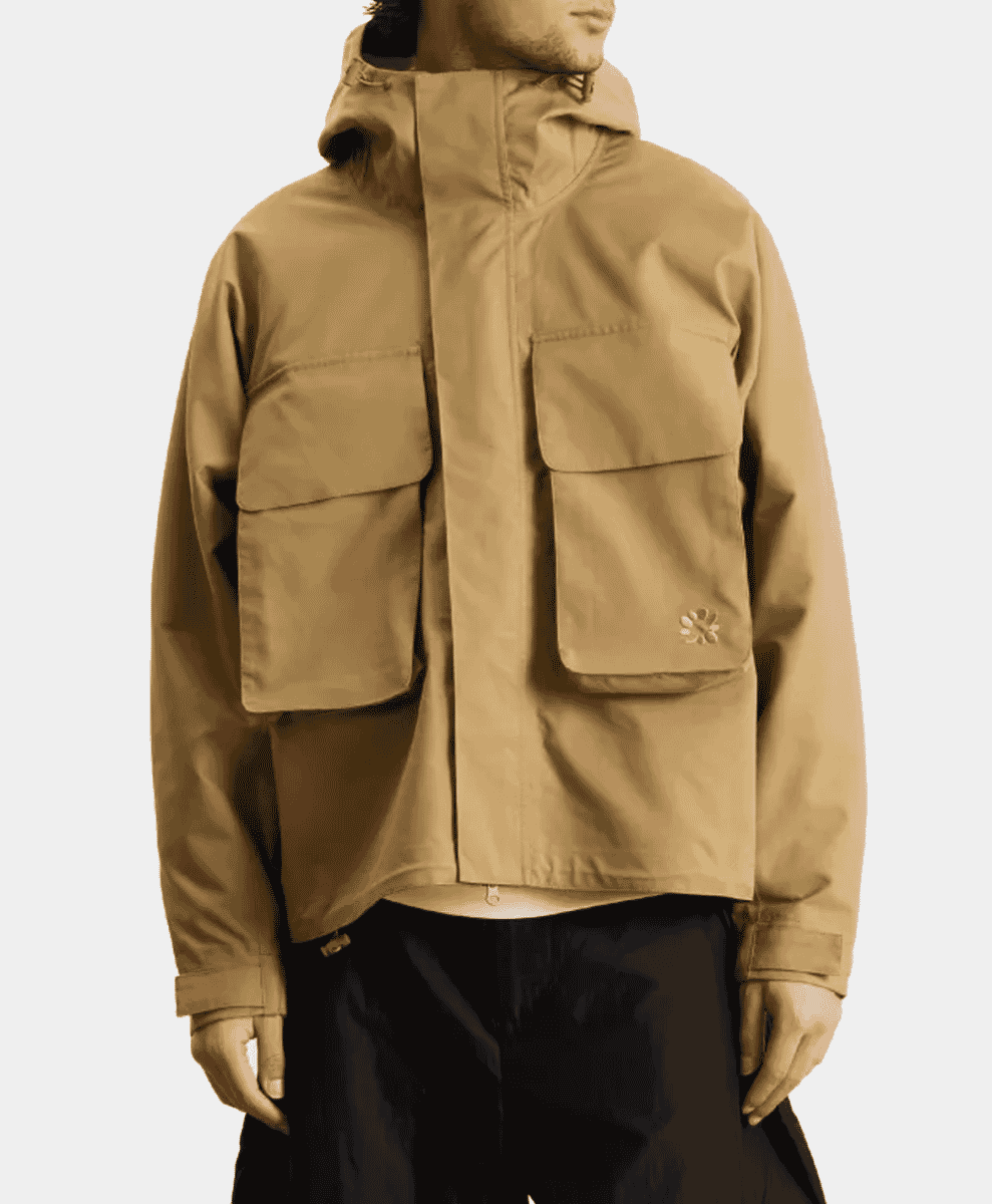 Tan hooded utility jacket with prominent large flap pockets.