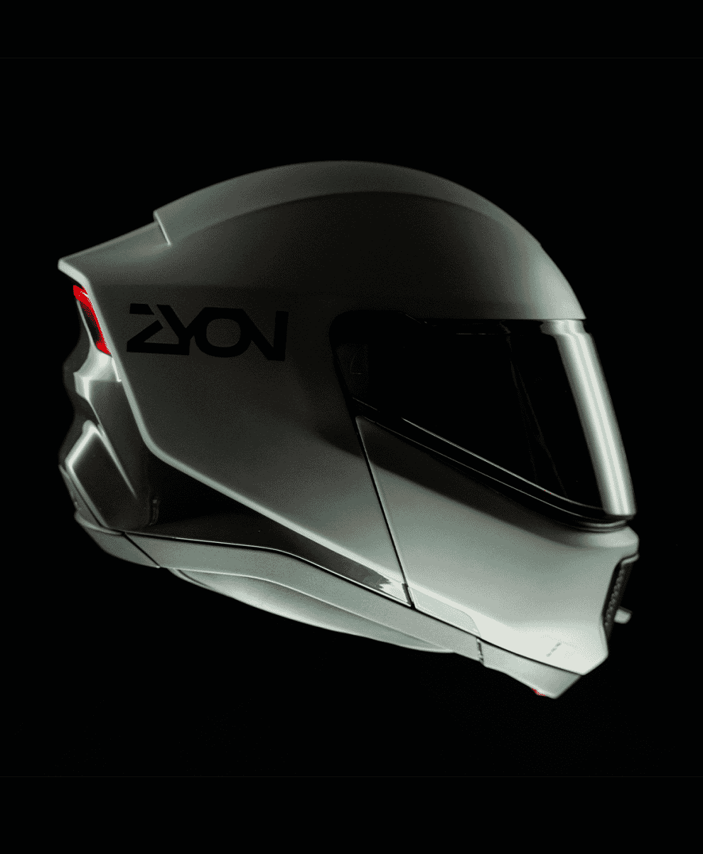 Close-up of a glossy silver ZYON helmet with aerodynamic branding